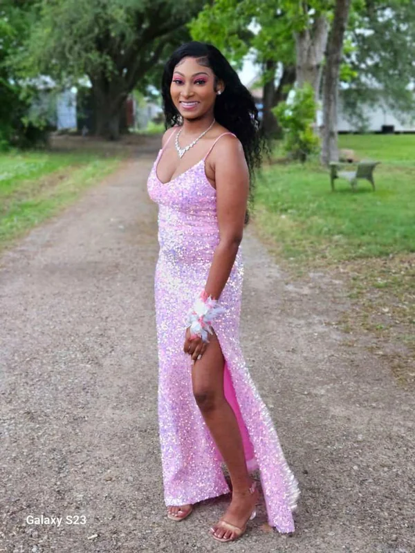 Dashayla Ardoin in a pink dress on a scenic path.