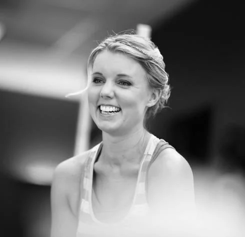 Smiling woman representing Hollywood celebrity gossip.