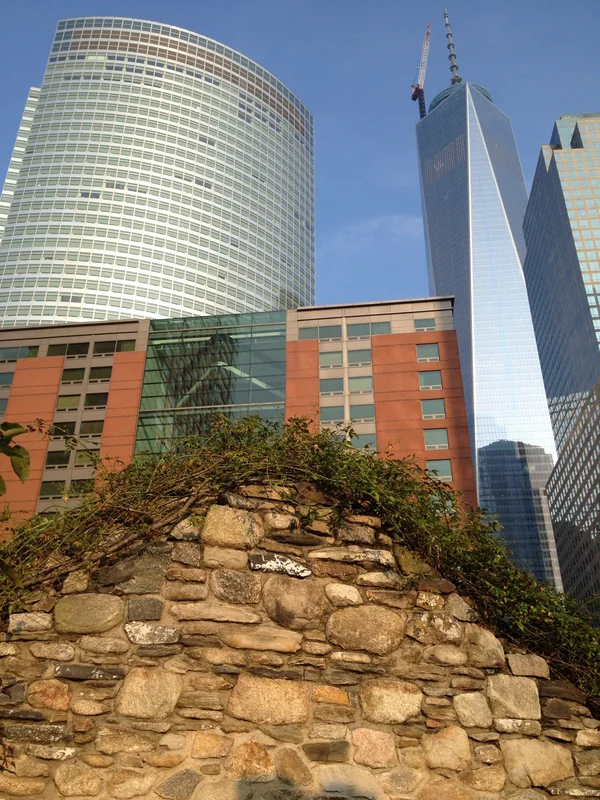 Frederick Heschel Bialik Stone surrounded by modern buildings.