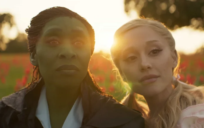 Cynthia Erivo and Ariana Grande in a field during Wicked filming.