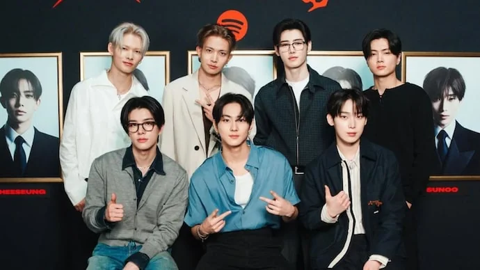 ENHYPEN donation event showcasing group unity and philanthropy efforts.