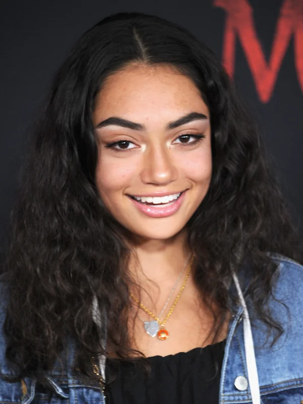 Avani Gregg at a red carpet event, showcasing her charm in her acting career.