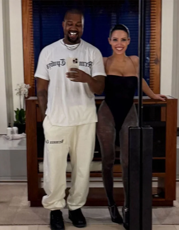 Kanye West and Bianca Censori smiling together amid divorce rumors.