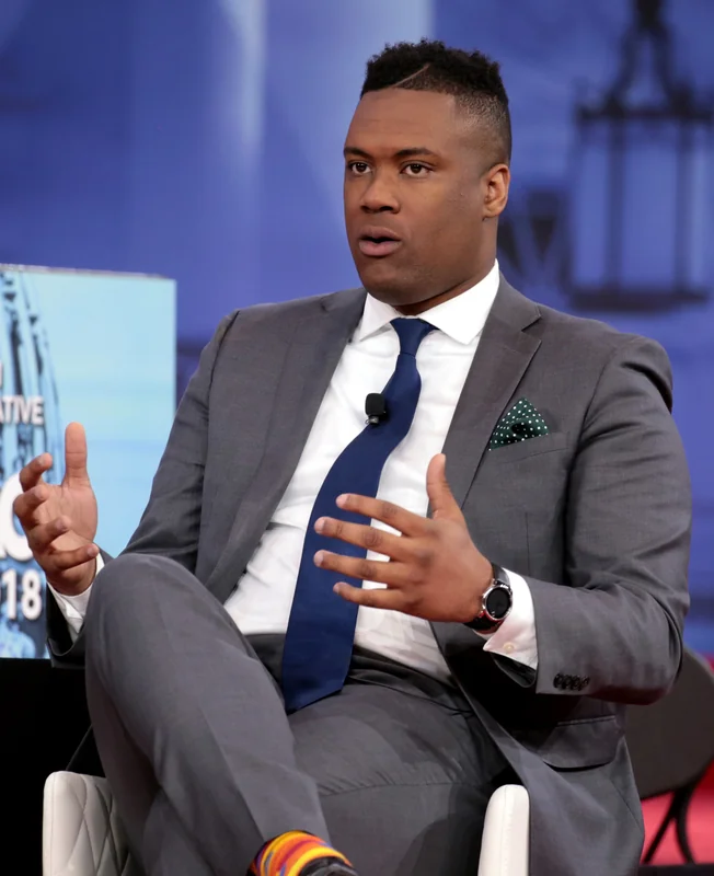 Lawrence Jones engaged in a panel discussion, which highlights his on-screen presence and prompts questions about how tall is Lawrence Jones.