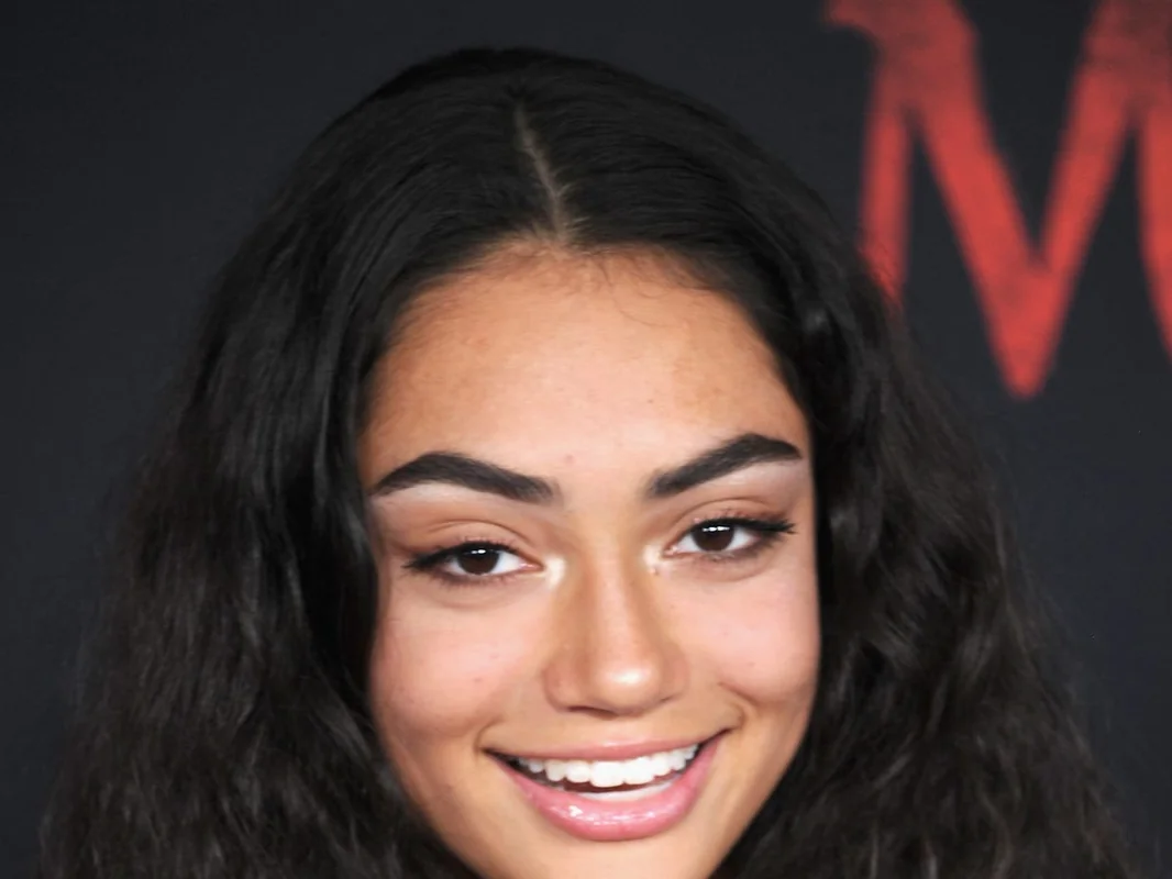 A close-up of Avani Gregg smiling, emphasizing her youthful energy and on-camera charisma.