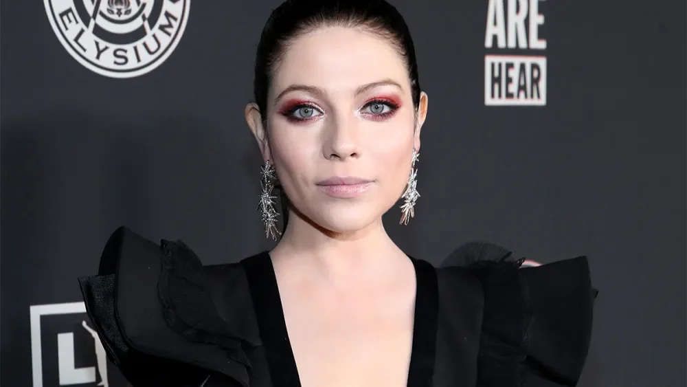 Timeline infographic of Michelle Trachtenberg’s life and career milestones, from child star to beloved TV icon