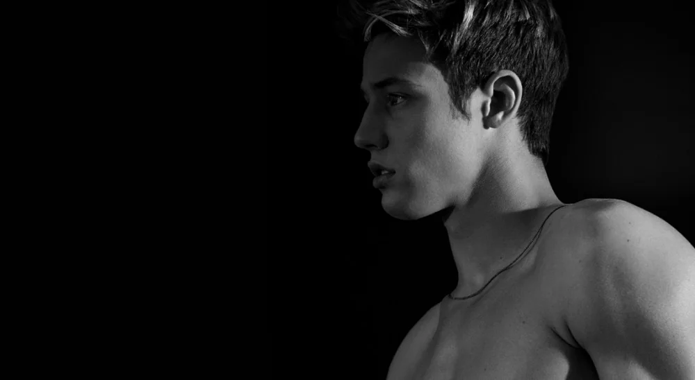 Cameron Dallas in a dramatic pose, reflecting his net worth.