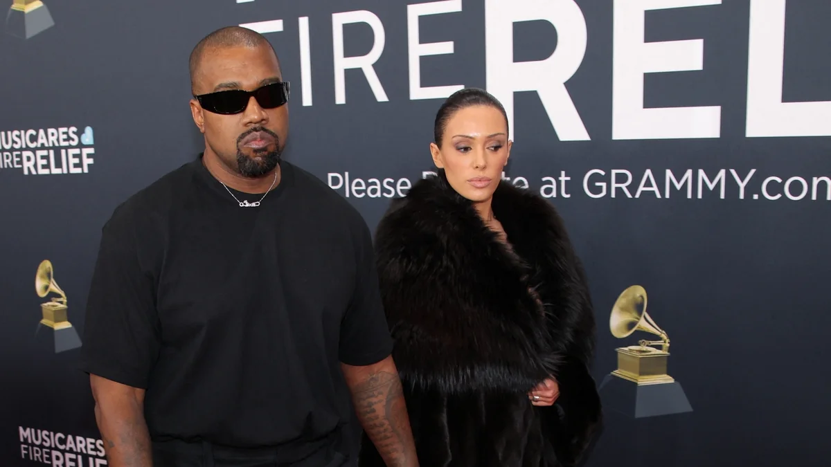 Kanye West and Bianca Censori walk together amid divorce speculation.