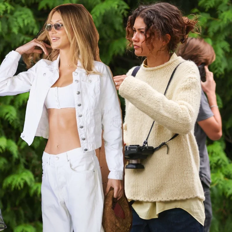 Elevated athleisure celebrity outfit with tonal matching set, tailored bomber, and minimalist sneakers