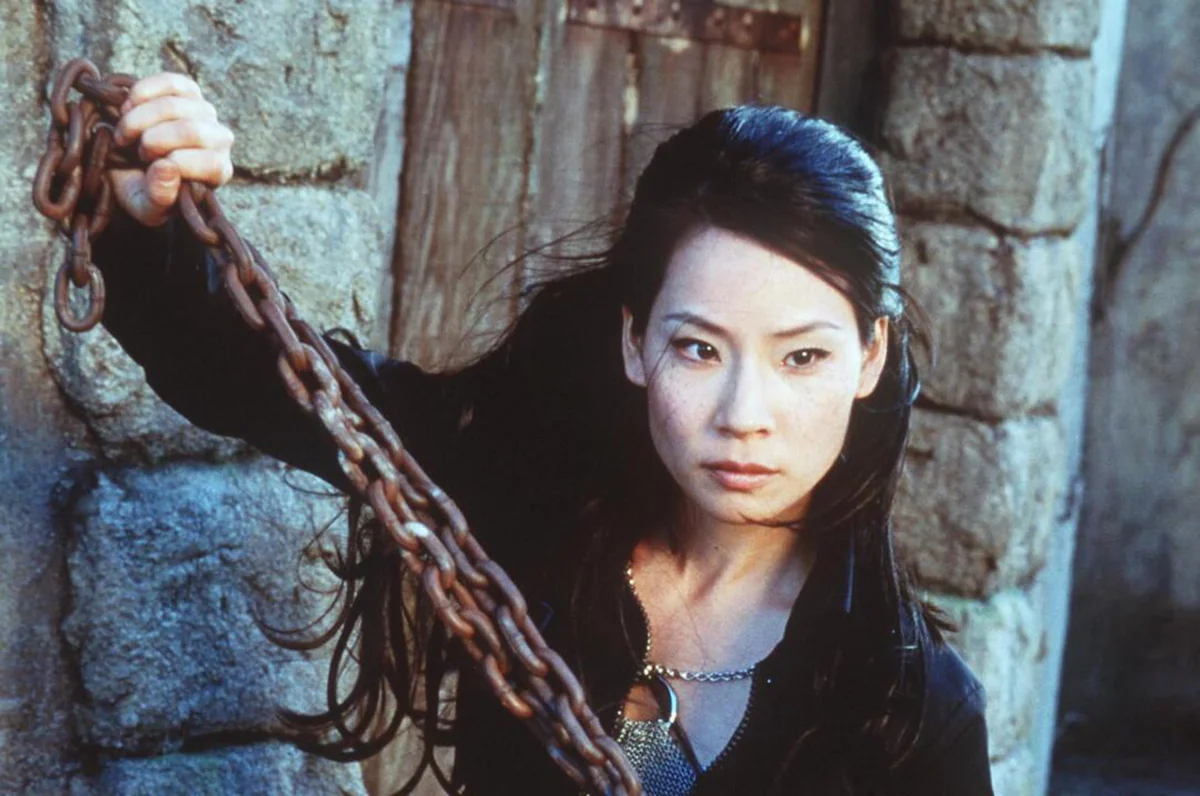 Lucy Liu in an action scene from a film.