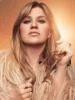 Kelly Clarkson showcasing her style, related to her popular songs.