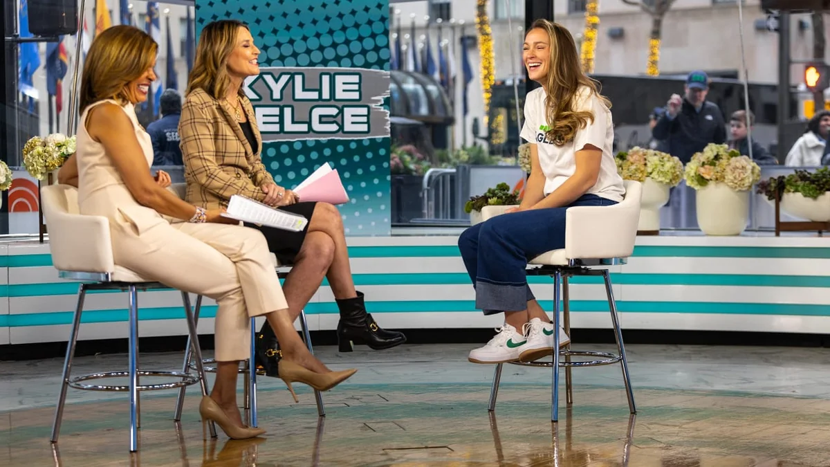 Kylie Kelce on a talk show discussing her Olympics gig.