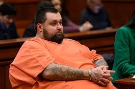 Carlos Jose Hernandez in court, deep in thought.