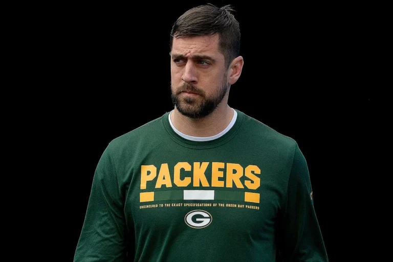Aaron Rodgers in Packers gear, hinting at his religion and personal beliefs.