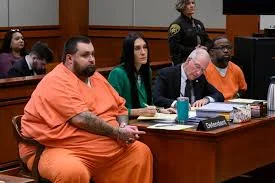 Carlos Jose Hernandez with his legal team in court.