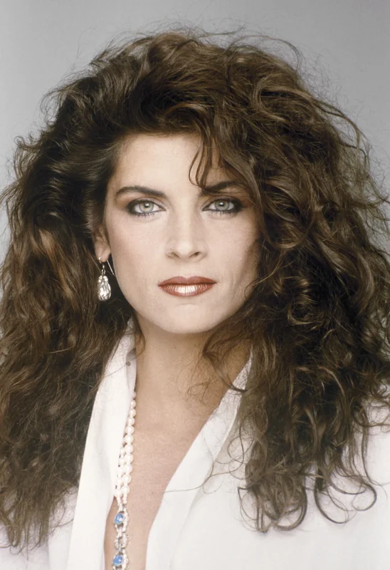Kirstie Alley with glamorous curls for kirstie alley tributes.