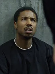 Michael B. Jordan displaying emotional depth in a dramatic scene.