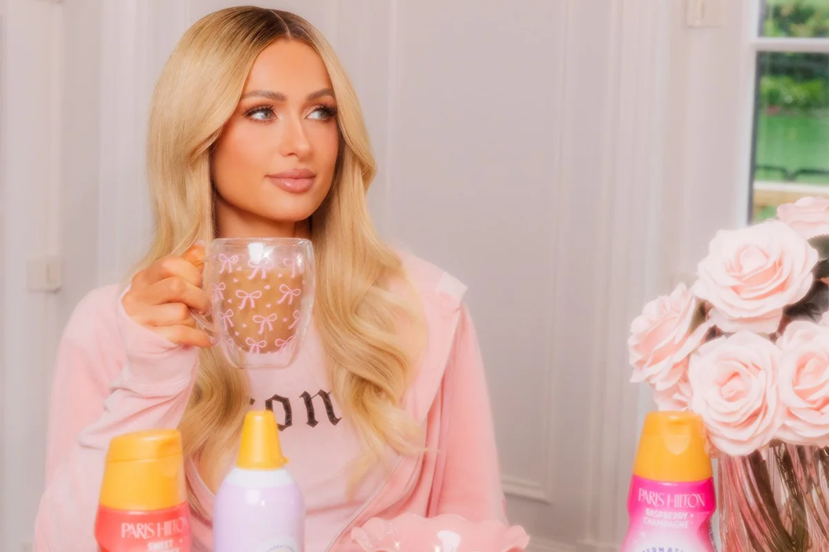 Paris Hilton enjoying coffee with her coffee creamers on display.