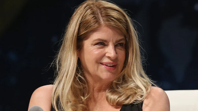Kirstie Alley smiling at an event, showcasing her charm related to kirstie alley net worth 2025.