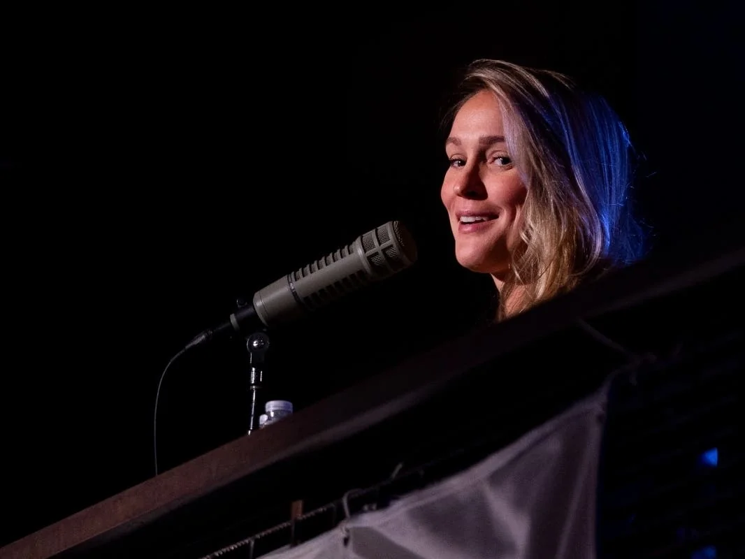 Kylie Kelce engaging with an audience during her Olympics gig.