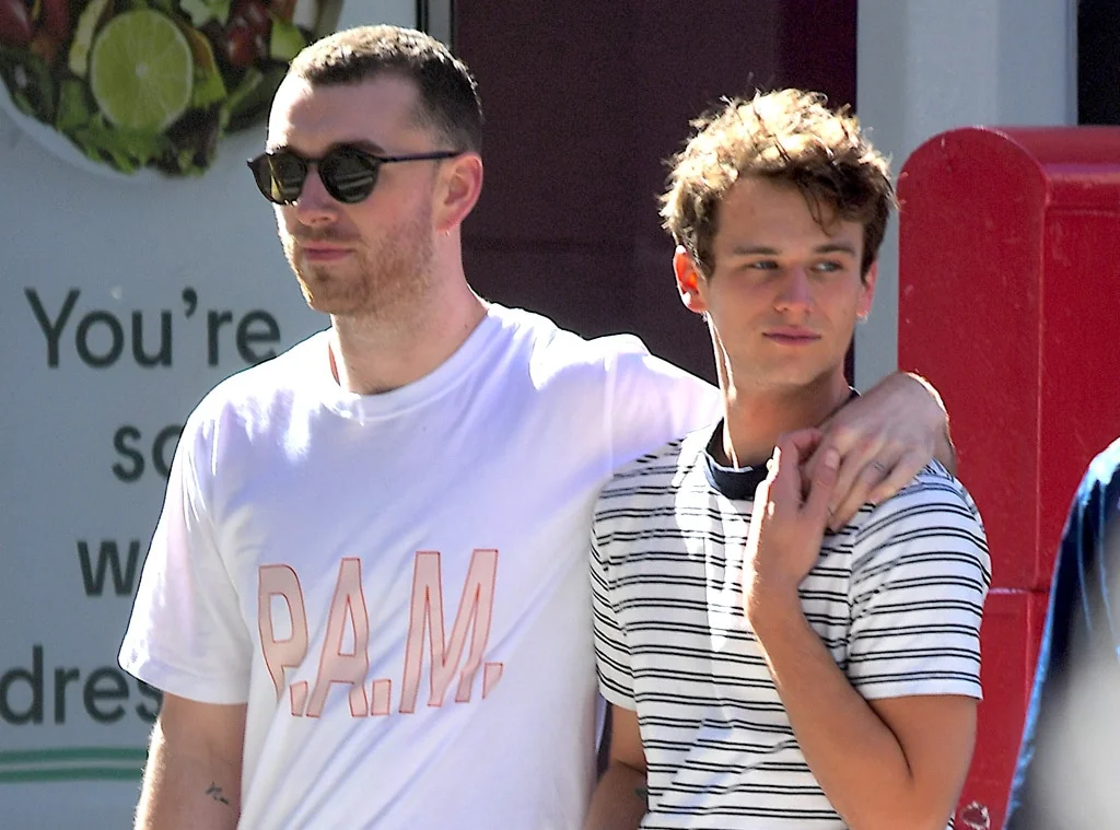 Brandon Flynn and Sam Smith walking together casually.