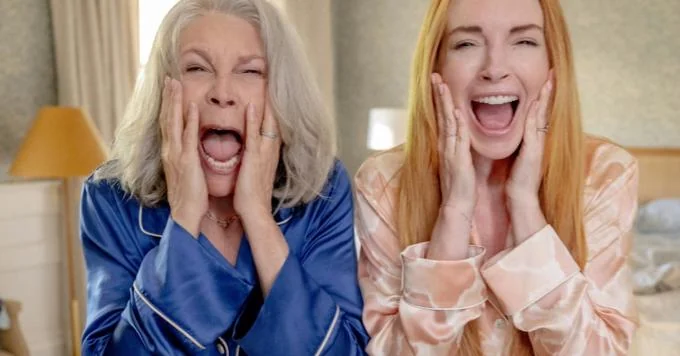 Jamie Lee Curtis and Lindsay Lohan in a comedic scene.