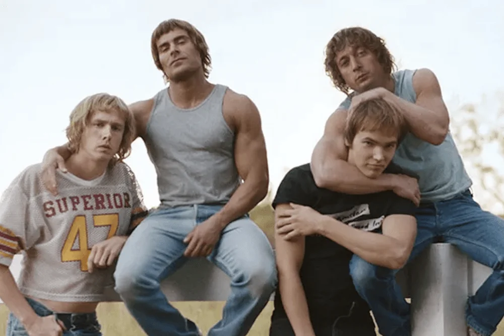 Zac Efron filmer with co-stars in relaxed pose