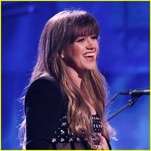 Kelly Clarkson engaging the audience with her songs on stage.