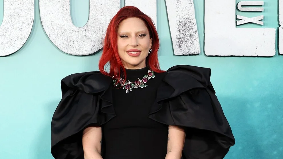 Lady Gaga wearing a unique necklace, showcasing her fashion style.