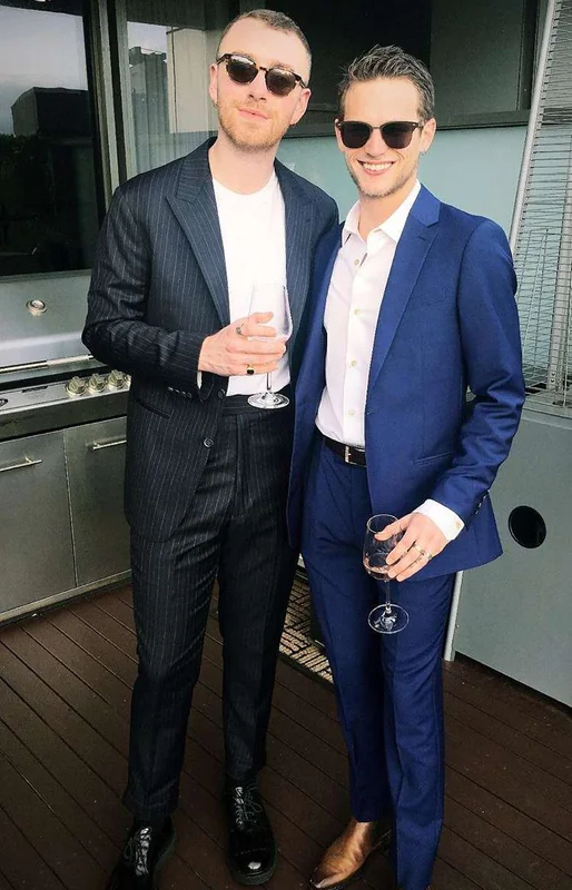 Brandon Flynn and Sam Smith at a social gathering.