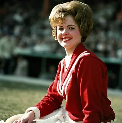 Young Phyllis Smith actress as a cheerleader, showcasing her early aspirations.
