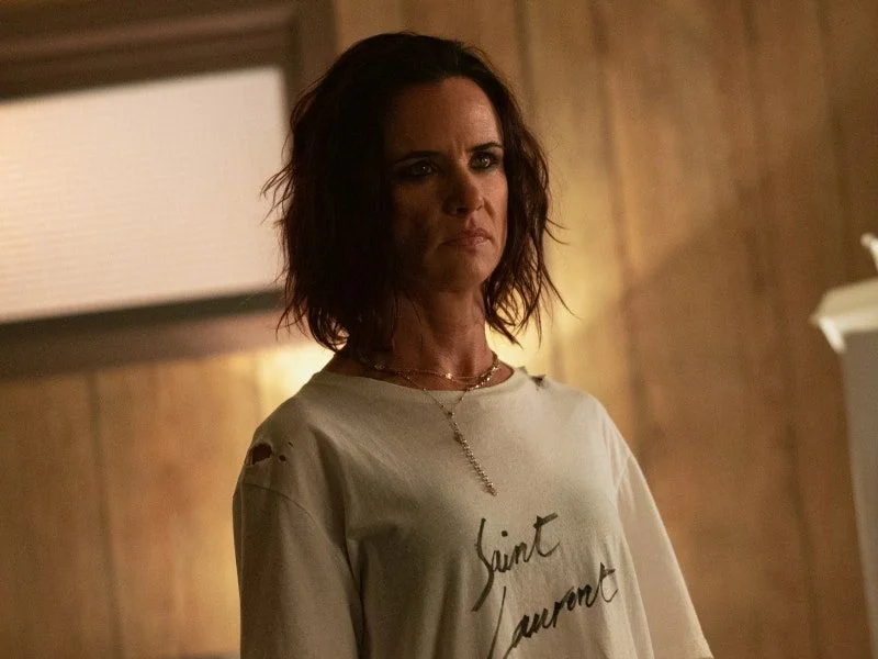 Juliette Lewis in a casual yet intense scene from Yellowjackets.