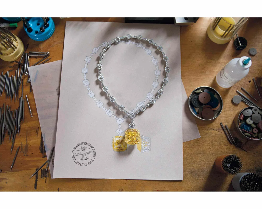 Design layout of a necklace featuring a yellow diamond like the Lady Gaga ring.