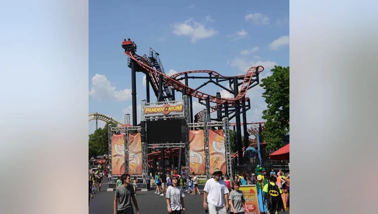 Crowded roller coaster area at Six Flags, despite incidents like 'died at Six Flags'.