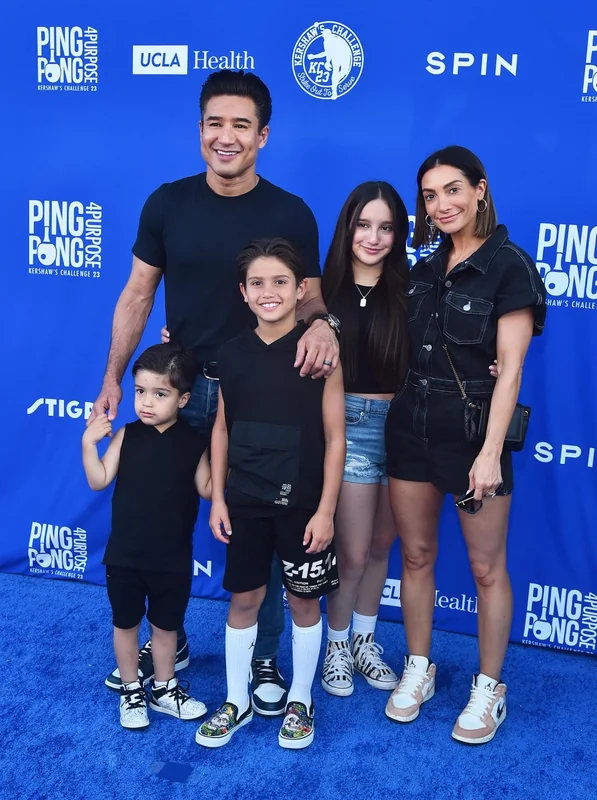 Mario Lopez TV host with family at charity event.