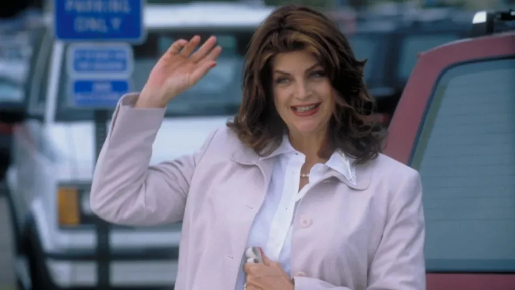 Kirstie Alley waving at fans, emphasizing her popularity related to kirstie alley net worth 2025.