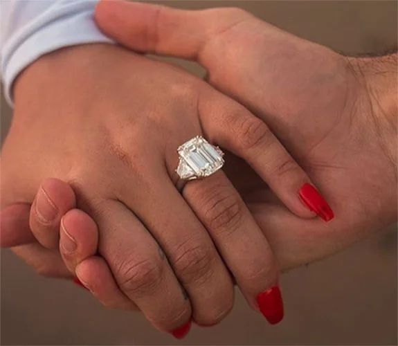 Romantic hand-in-hand photo that highlights Demi Lovato's engagement ring