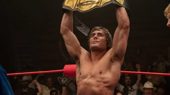 Zac Efron filmer celebrating victory with championship belt